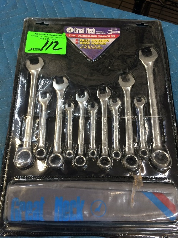 lot 112 image: 11 Piece Combination wrench set, Dewalt Drill Bit holder, Drill Index set  NEW