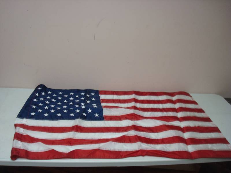 lot 30 image: 4 Foot Long US Flag, Used, Might Be Vinyl