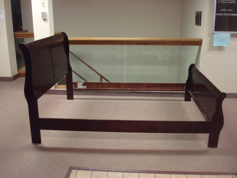 lot 84 image: Ashley Signature Design Queen Size Bed Frame, Used, Some Wear, Scratches, Missing Planks