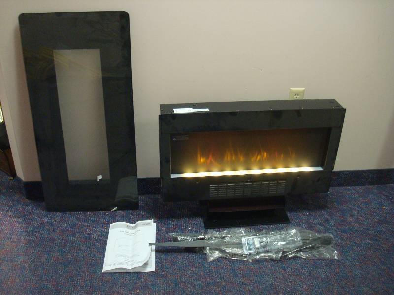 lot 100 image: Home Decorations Fire Place Heater, Unused, Glass Is Loose, Works, Dusty