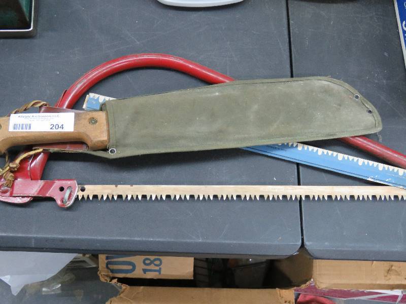 lot 204 image: Machete and saw