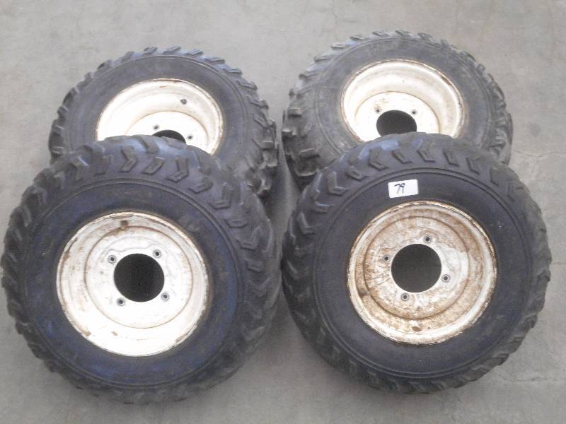 lot 79 image: (4) 4-Lug ATV Wheels With 24811 &...