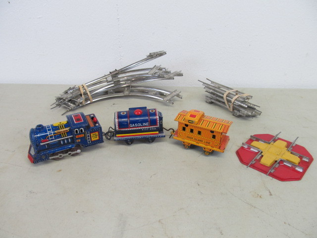 lot 56 image: NICE Complete Alps Rock Island Tin Toy Train