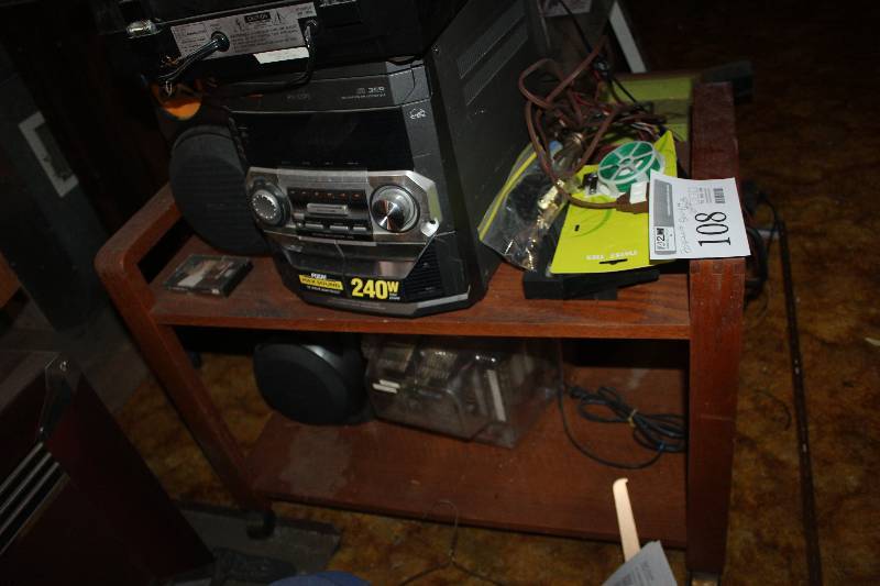 Shelf & Contents Including Portable Stereo, Power Cables, And More