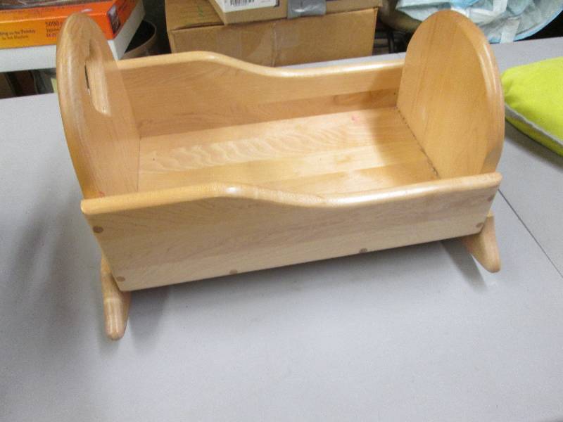 lot 75 image: Solid wood doll cradle...