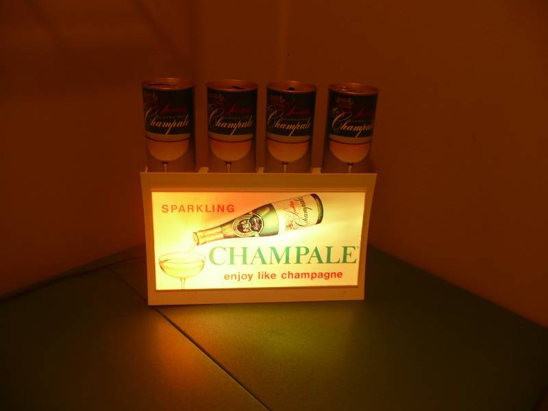 lot 17 image: Vintage & Rare Champale Light And 4 Vintage Champale Cans - Multi Switching Color Light - Nice Condition - Very Cool Light