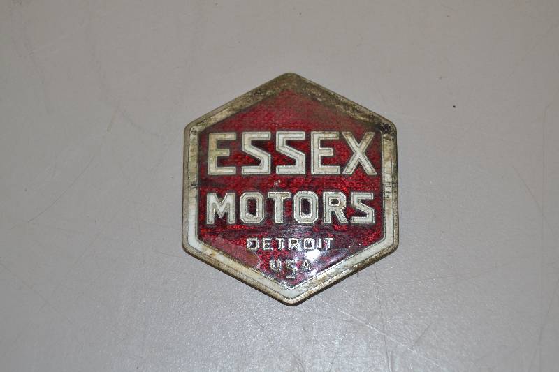lot 8 image: Vintage Essex motors emblem