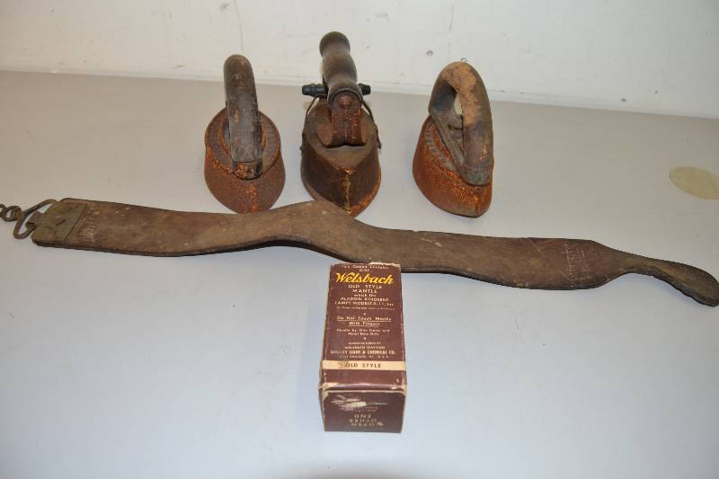 lot 54 image: Vintage irons and razor sharpener