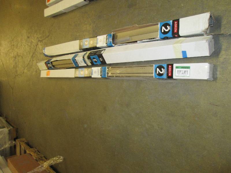 lot 137 image: 3-packages of 31 in. Pivoting Showe...