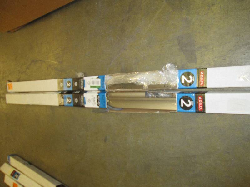 lot 138 image: 2 packages of 31 in. Pivoting Showe...