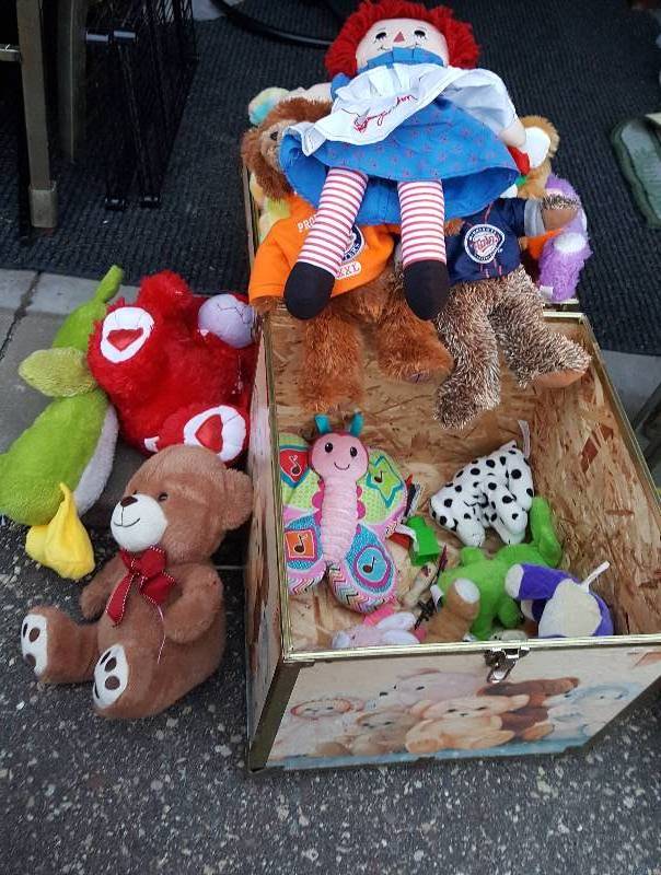 Toy trunk full of stuffed animals.