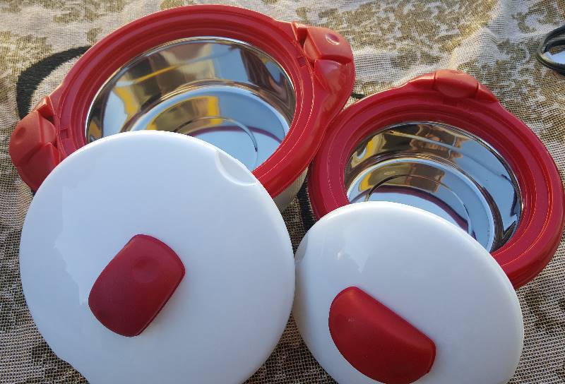 Two round warmer dishes