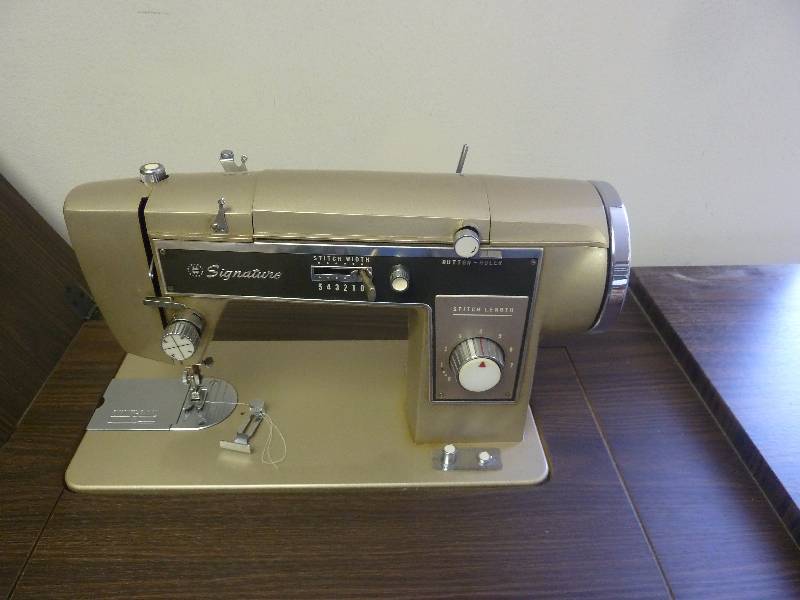 lot 52 image: Signature Sewing Machine In Cabinet