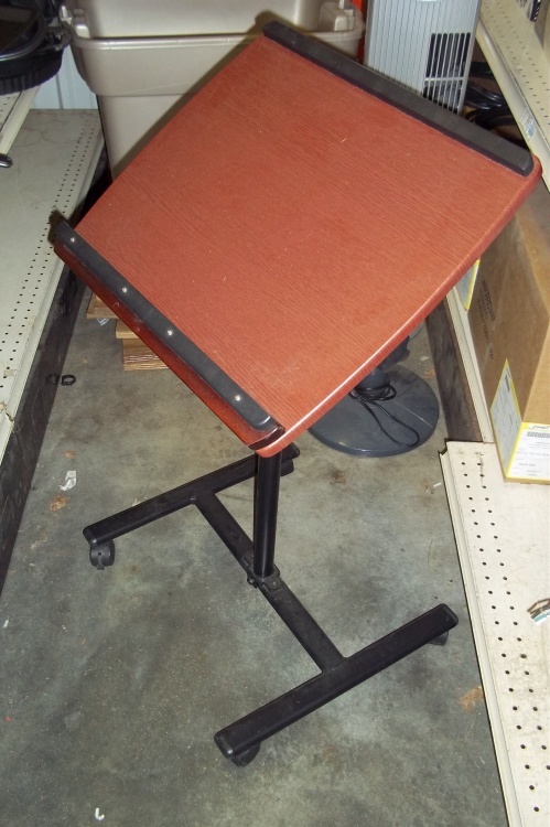Small table on wheels, adjustable top