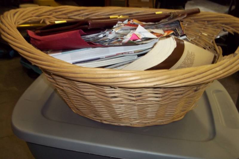 Basket with books and leather portfolio with latch