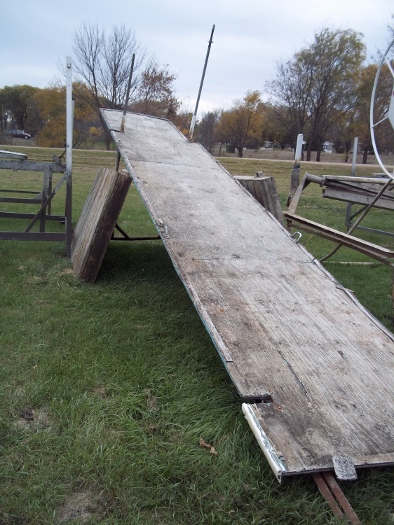 Steel Roll in Dock with parts Roll in part is 4 x 24 and 2 -4 x 8 standing wood sections