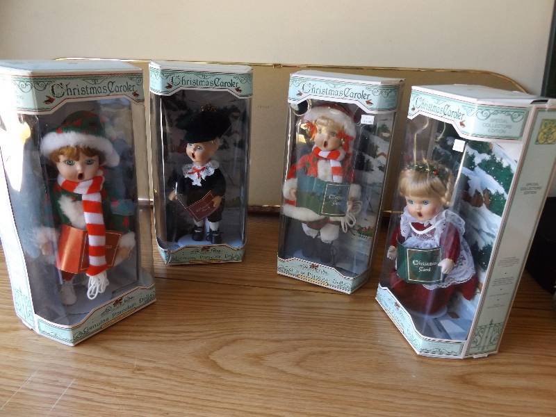 lot 453 image: Four Collectible Caroler Dolls