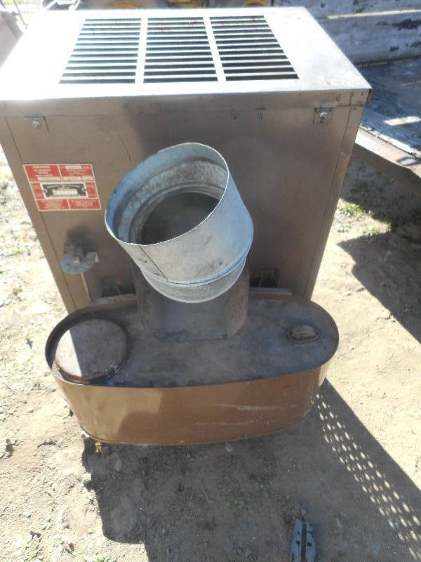 lot 143 image: OIL BURNING STOVE