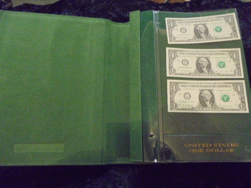 2003 Uncut $1 Notes & Cut 2009 $1 Notes, with World Reserve Monetary Exchange Album, $7 Face Value
