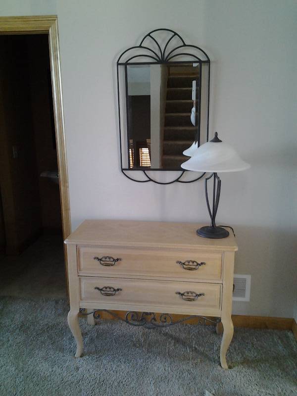lot 15 image: Thomasville 2-Drawer Console Table With Metal Scroll Work, Metal Frame Wall Mirror, Metal Lamp With Frosted Glass Shade