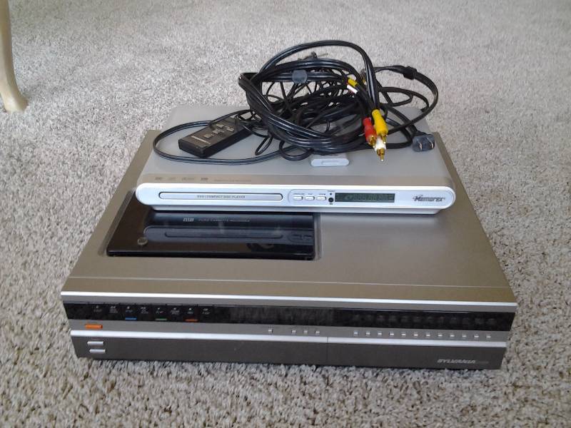 lot 26 image: Memorex DVD With Remote, Sylvania VHS With Remote