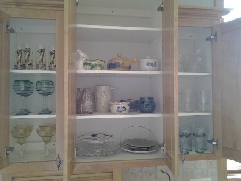 lot 91 image: Contents In Cabinet Stemware, Juice Glasses, Coke Glasses, Pottery Pitchers, Trays, More