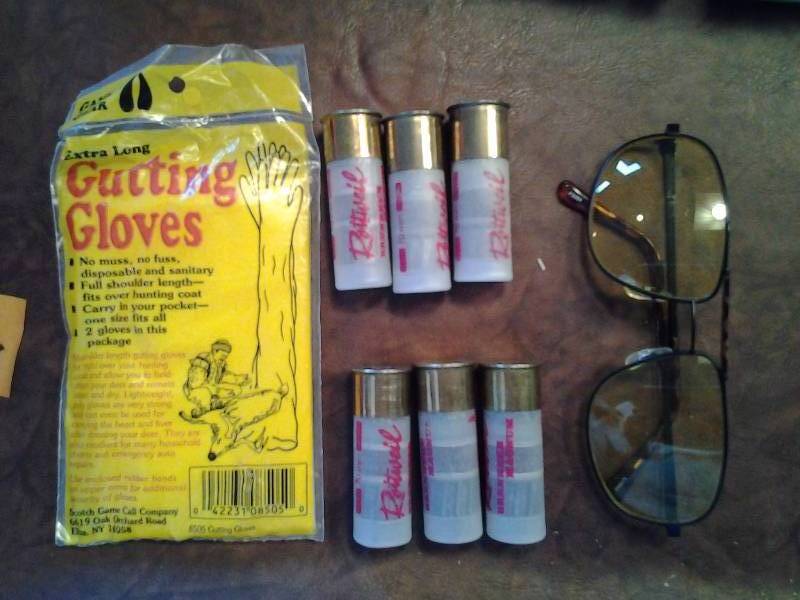 lot 112 image: 6- 12 Ga 2-34 Slugs, Gutting Gloves, Shooting Glasses