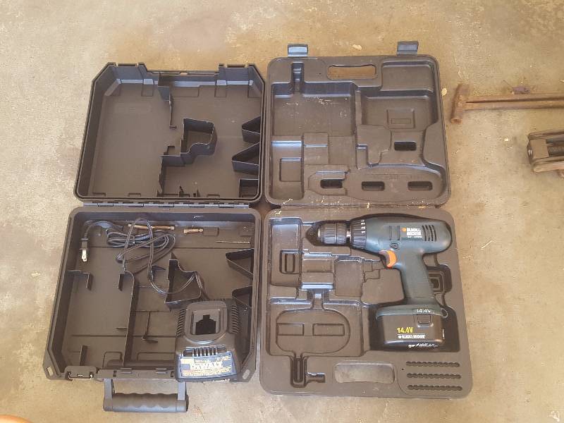 lot 207 image: Black & Decker 14 Volt Drill With Dewalt Charger & Cases