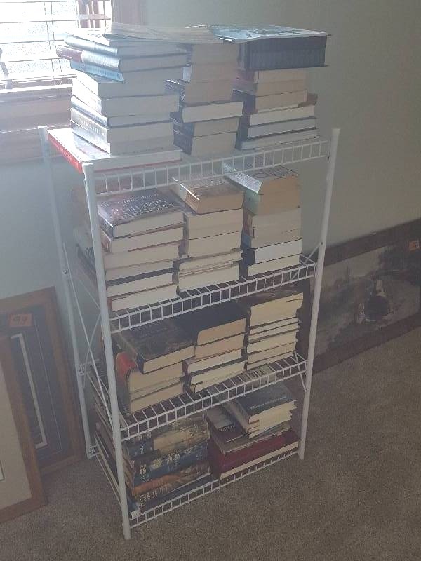 lot 104 image: White Wire Shelf With Assorted Books  17-Frank Yerby Vintage Books, Lake Minnetonka Coffee Table Picture Books, Lots More