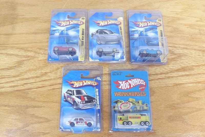 5 MINT on Card Hot Wheels Tesla Roadsters, Datsun Bluebird, and Workhorses in Protecters