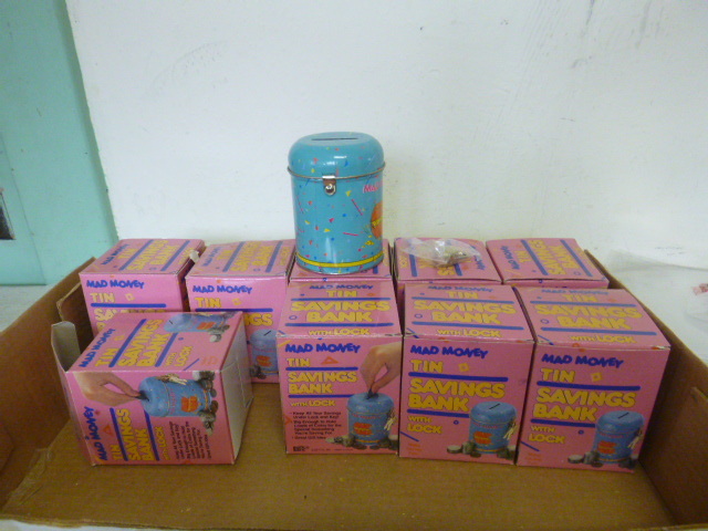 lot 159 image: 9 Mad Money Tin Banks