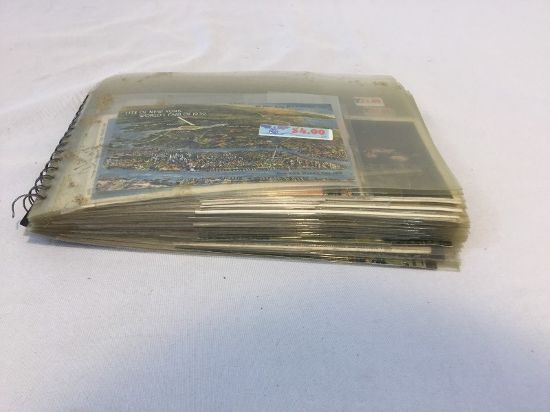 Book with about 55 Vintage mainly worlds fair postcards