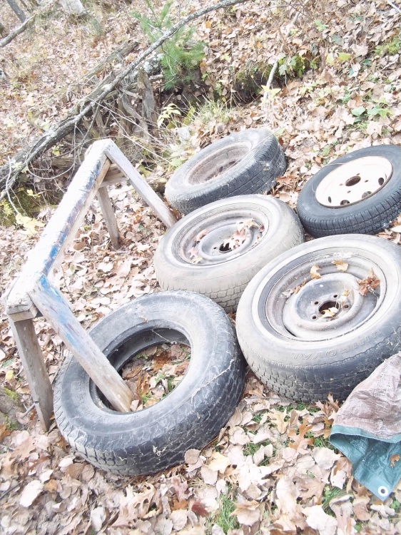 Group of Tires and Saw Horse