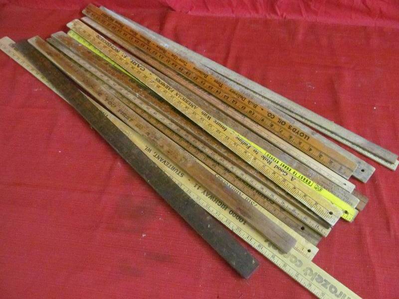 vintage square advertising yard sticks