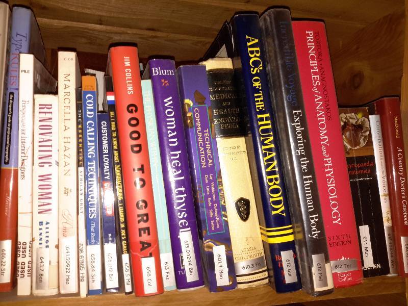 lot 130 image: Books on the book shelf as pictured