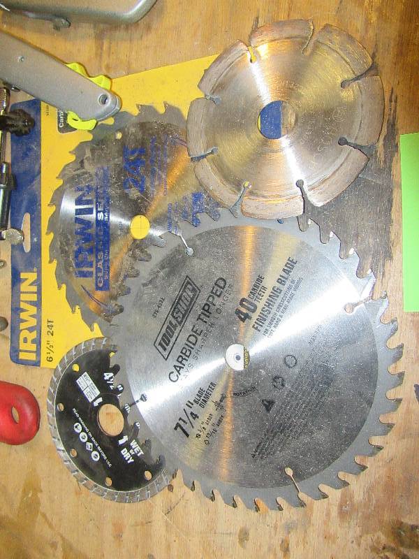 lot 152 image: Misc. Wrenches and Saw Blades as pictured