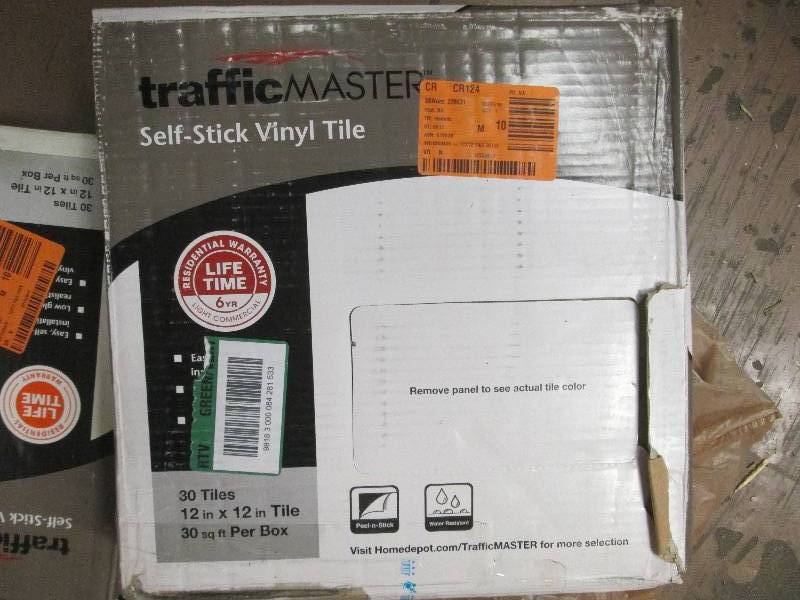 8 boxes of self stick  floor tile d...