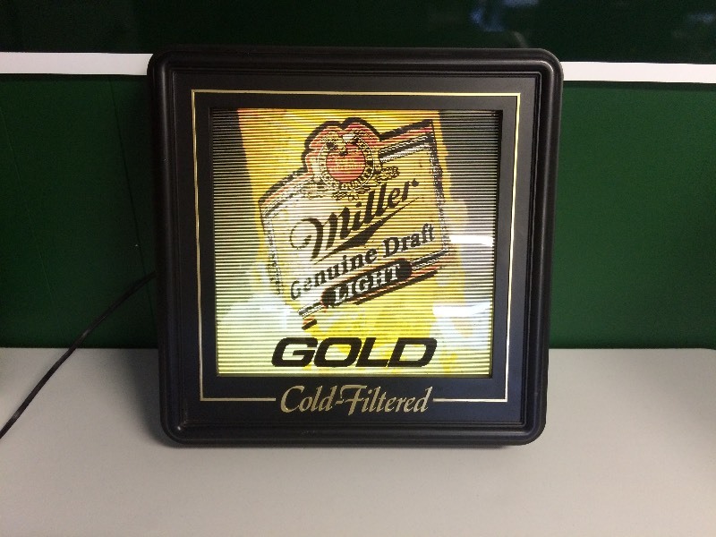 lot 33 image: MILLER GENUINE DRAFT BEER LIGHTED BEER SIGN