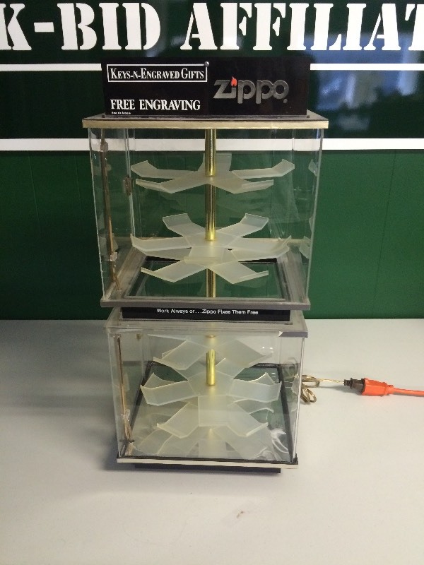 lot 47 image: LIGHTED ZIPPO LIGHTER REVOLVING MULTI-LEVEL DISPLAY