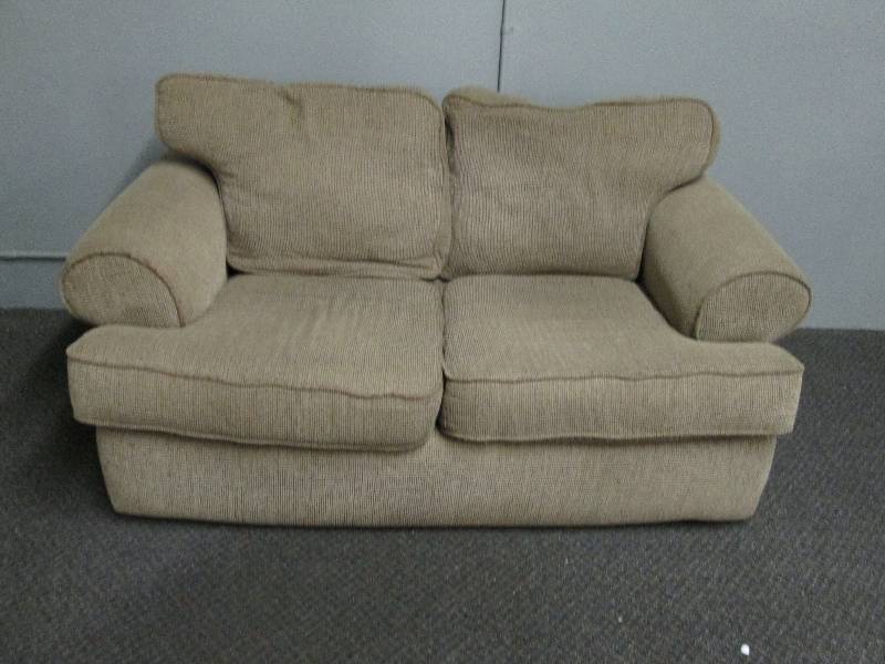lot 134 image: Tan Love Seat