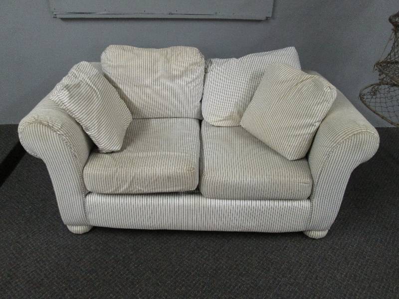 lot 135 image: Tan Love Seat