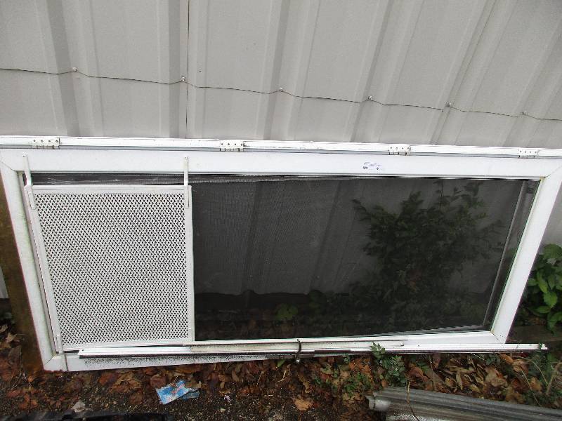 lot 99 image: 2 storm doors and 1 window