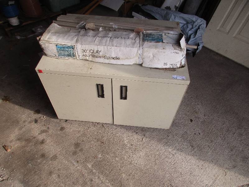 lot 140 image: deck spindles and cabinet on wheels