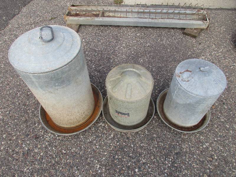 lot 143 image: poultry feeders and watering units and plastic wheelbarrow