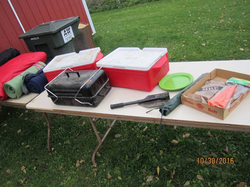 Lot of sleeping bags, coolers, camp...