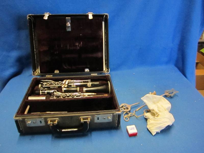 lot 232 image: Older clarinet with extra accessori...