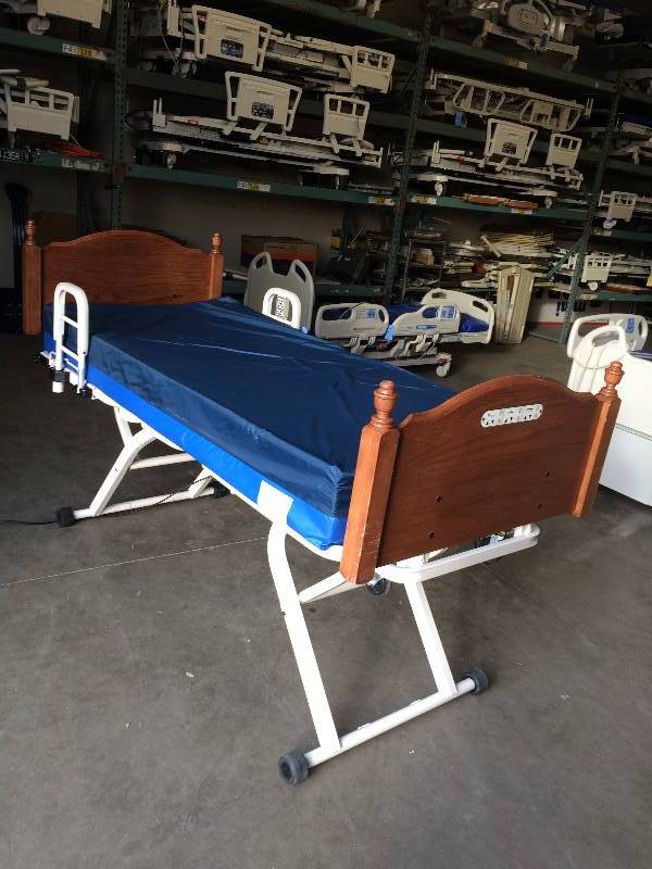 lot 71 image: BIG WOW  HOME HEALTH CARE MEDICAL POWER ADJUSTIBLE BED FROM FLOOR TO HIP HEIGHT - WOOD HEADBOARD FOOTBOARD EXCELLENT SEE VIDEO