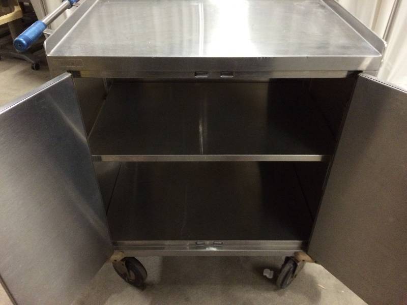 lot 57 image: New Retails $2500 Wow Rolling Heavy Duty Stainless Steel Medical 2 Door 2 Shelf Mobile Case Cart With Handle & Bumper Guards - Super Nice Condition