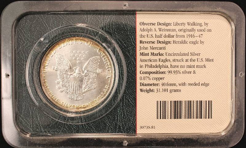 1986 AMERICAN SILVER EAGLE 1 TROY OZ. .999 FINE SILVER IN LITTLETON HOLDER