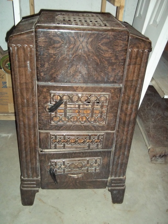 lot 66 image: Montgomery Ward Ceramic Coated Metal Wood Burner